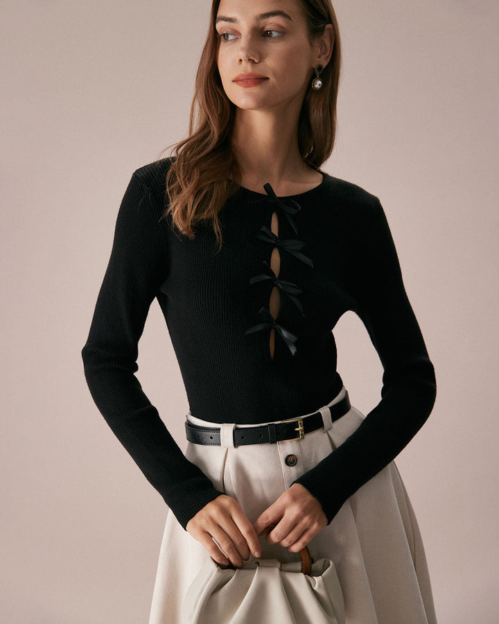SALE | Dark navy blue top with a boat neckline, bow in front, and knitted texture