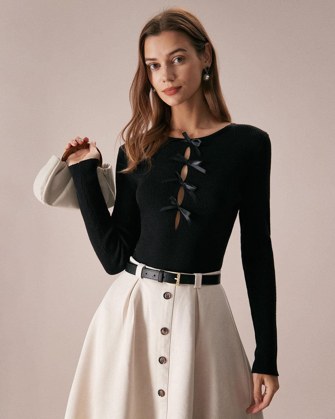 SALE | Dark navy blue top with a boat neckline, bow in front, and knitted texture