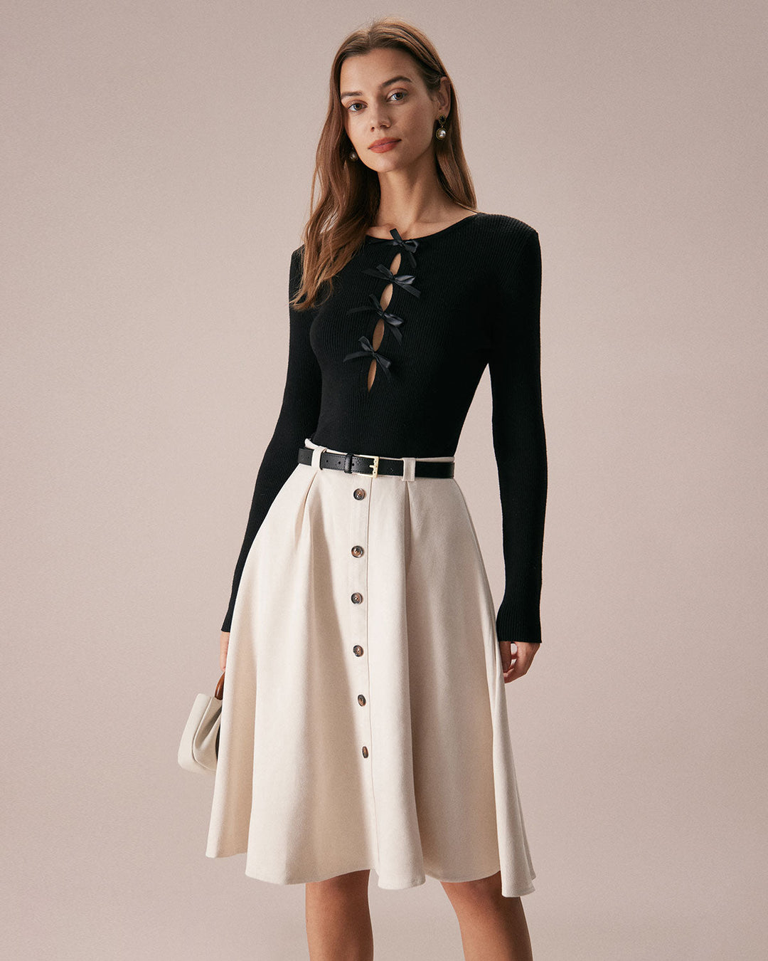 SALE | Dark navy blue top with a boat neckline, bow in front, and knitted texture