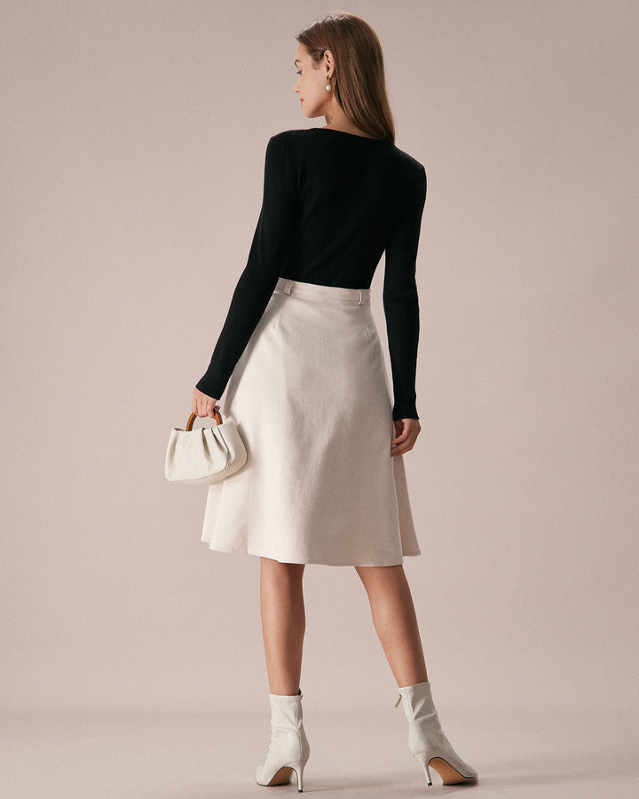 SALE | Dark navy blue top with a boat neckline, bow in front, and knitted texture