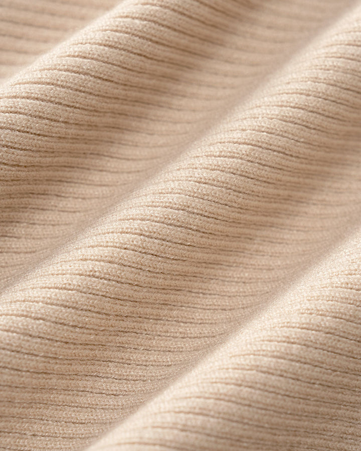 SALE | Fitted knit dress with V-neck and apricot accents
